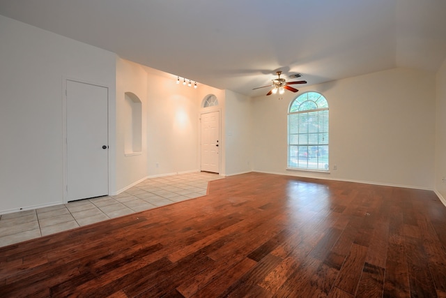 9104 Chesapeake Ln, Mckinney, TX 75071 - spare room featuring wood finished floors, ceiling fan, and baseboards