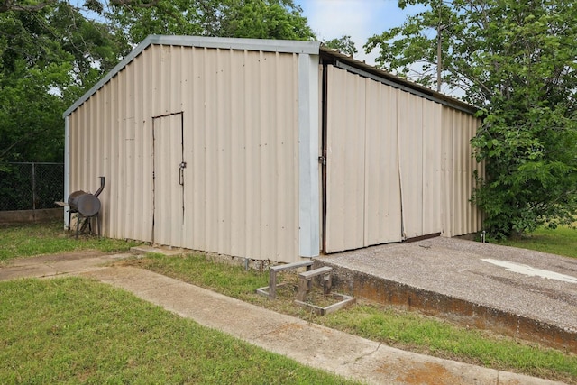 view of outdoor structure with fence