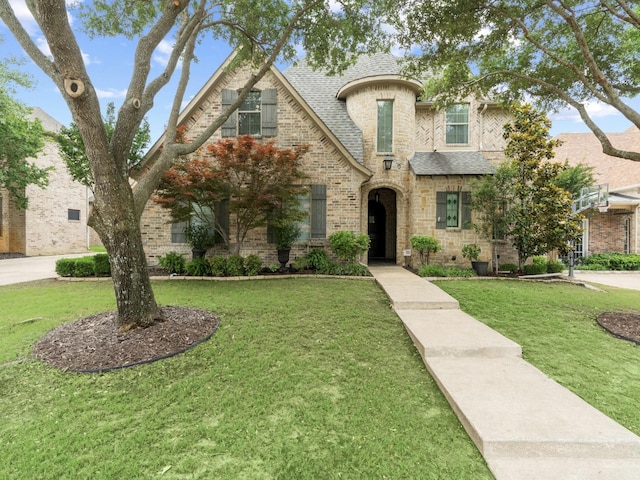 10 Tennis Village Dr, Heath, TX 75032 - french country inspired facade with a front yard, roof with shingles, stone siding, and brick siding