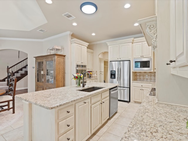 10 Tennis Village Dr, Heath, TX 75032 - kitchen featuring stainless steel appliances, arched walkways, crown molding, light tile patterned floors, and recessed lighting