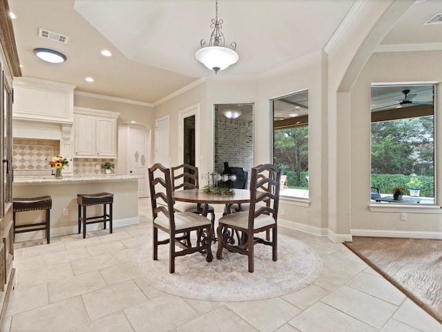 10 Tennis Village Dr, Heath, TX 75032 - dining space featuring arched walkways, light tile patterned flooring, crown molding, ceiling fan, and recessed lighting