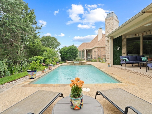 10 Tennis Village Dr, Heath, TX 75032 - view of pool featuring outdoor lounge area, a patio area, a fenced backyard, and a pool with connected hot tub