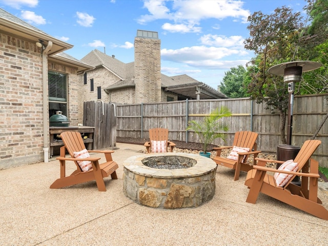 10 Tennis Village Dr, Heath, TX 75032 - view of patio / terrace featuring an outdoor fire pit