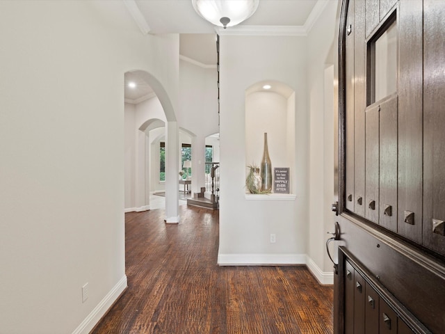 10 Tennis Village Dr, Heath, TX 75032 - entryway with dark wood finished floors, ornamental molding, baseboards, and arched walkways