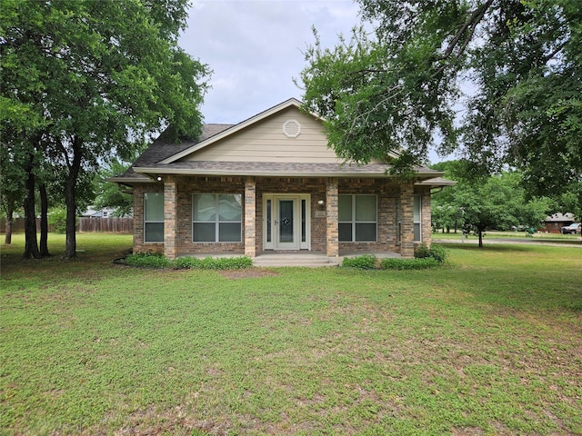 bungalow with fence and a front yard