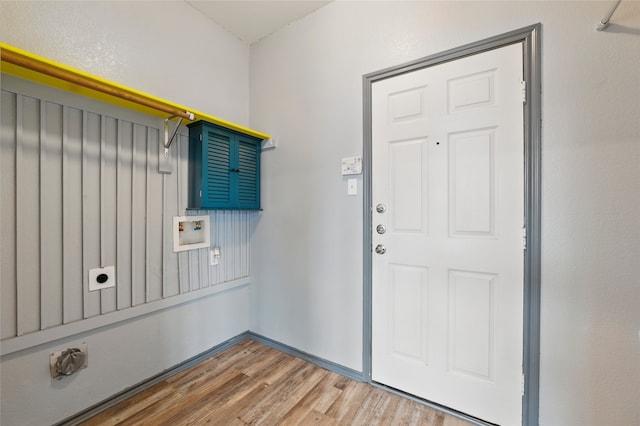 laundry room with washer hookup, laundry area, electric dryer hookup, and wood finished floors