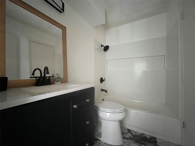 full bath featuring vanity, toilet,  shower combination, and marble finish floor