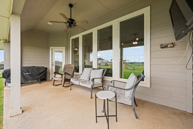view of patio / terrace featuring ceiling fan
