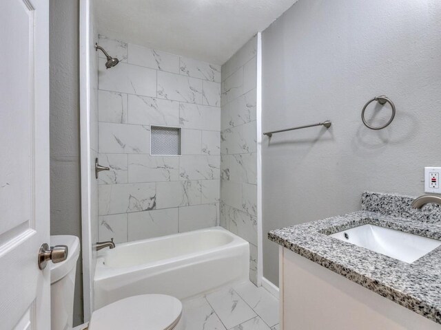 full bath featuring vanity, marble finish floor, toilet, baseboards, and  shower combination