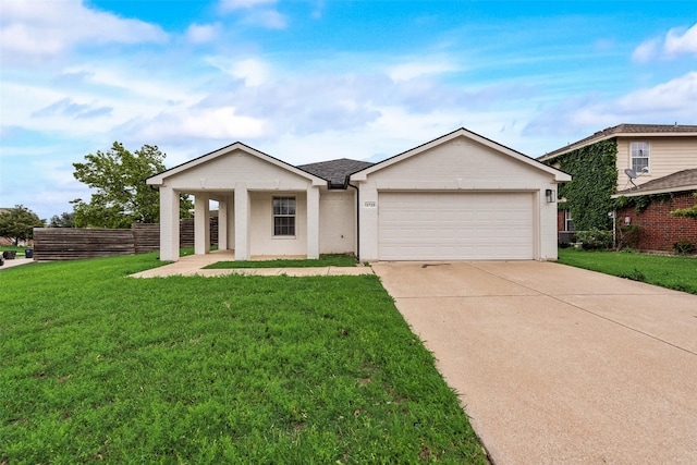 ranch-style home featuring a garage, fence, driveway, and a front yard