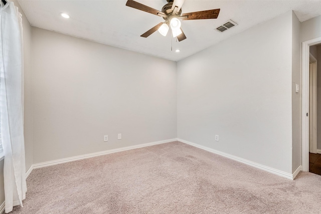 carpeted empty room with visible vents, recessed lighting, baseboards, and ceiling fan
