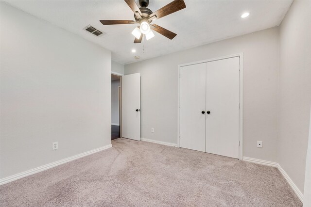 unfurnished bedroom with light colored carpet, baseboards, visible vents, and recessed lighting