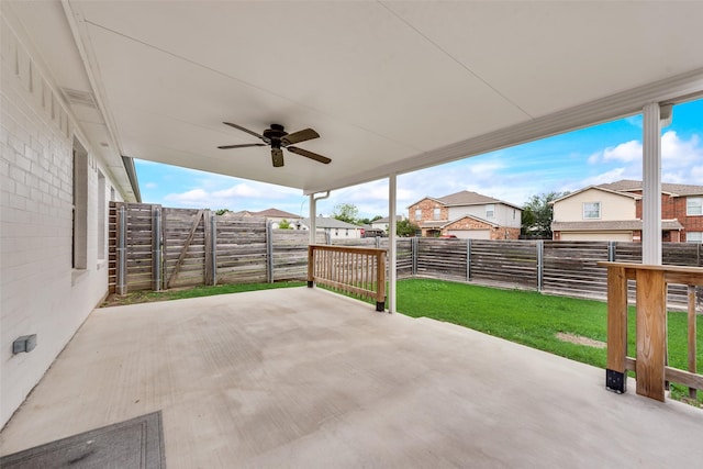 view of patio with a ceiling fan, a fenced backyard, and a residential view