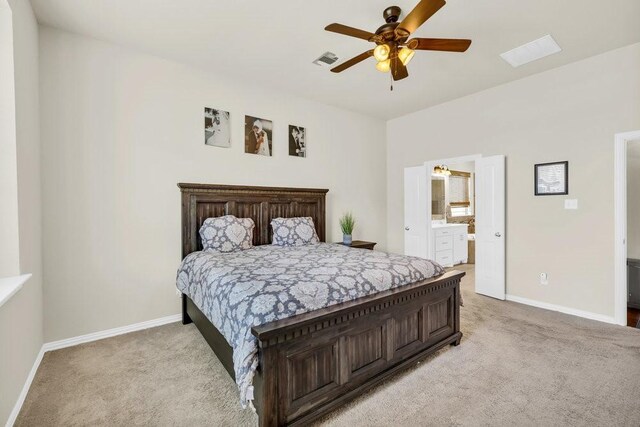 bedroom with visible vents, baseboards, and light carpet