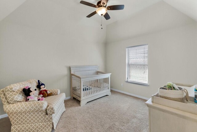 carpeted bedroom featuring baseboards, a ceiling fan, and lofted ceiling