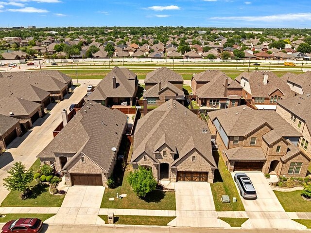 birds eye view of property with a residential view