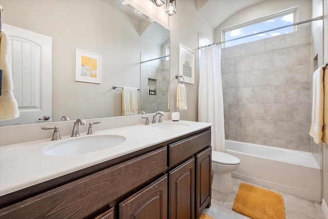 bathroom with double vanity, toilet, shower / bathtub combination with curtain, and a sink