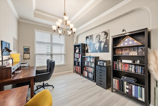home office with an inviting chandelier, ornamental molding, wood finished floors, baseboards, and a raised ceiling