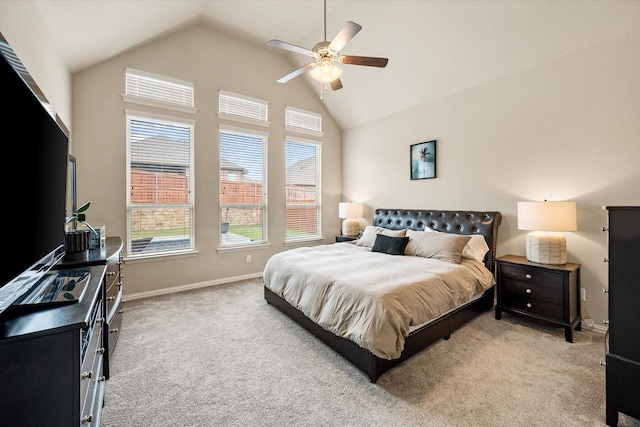 bedroom with baseboards, a ceiling fan, high vaulted ceiling, and light carpet