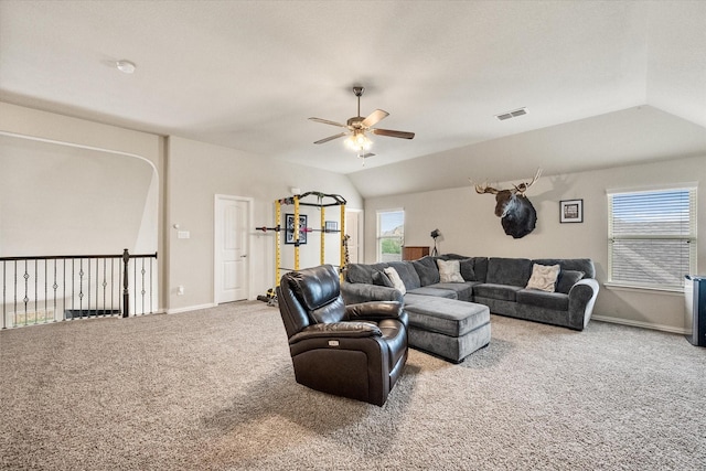 carpeted living room with visible vents, baseboards, ceiling fan, and lofted ceiling