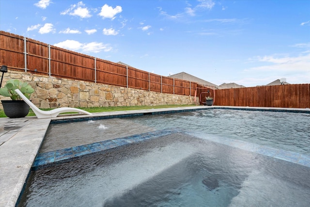 view of swimming pool with a fenced backyard and a fenced in pool