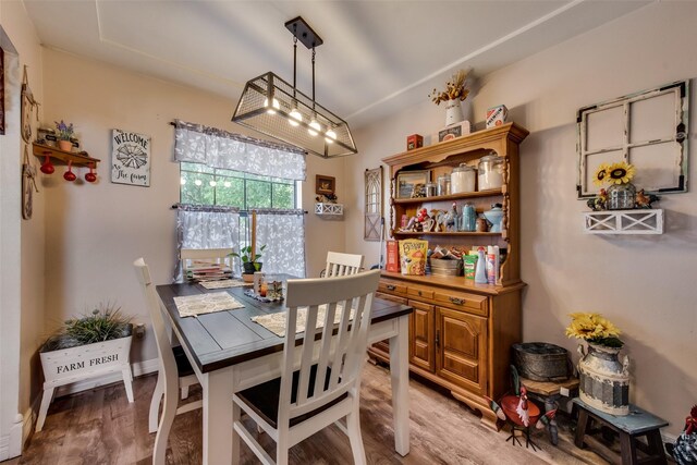 dining space featuring light wood-style flooring
