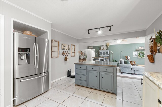 kitchen with stainless steel fridge with ice dispenser, rail lighting, a ceiling fan, open floor plan, and light tile patterned floors