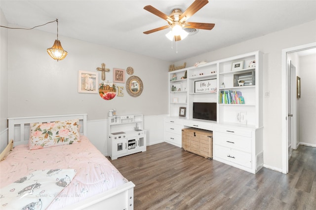 bedroom featuring baseboards, a ceiling fan, and dark wood finished floors