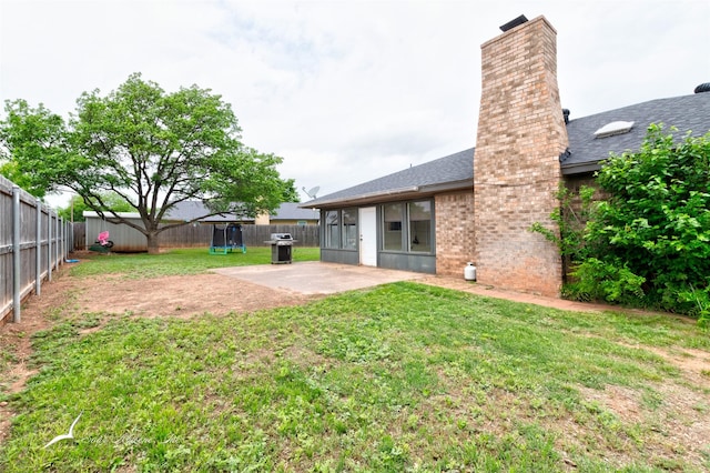 view of yard featuring a patio and a fenced backyard