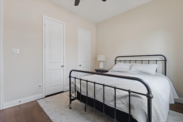bedroom featuring baseboards, a ceiling fan, and wood finished floors