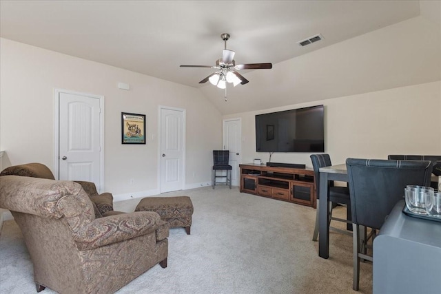 living room with visible vents, a ceiling fan, carpet, and lofted ceiling