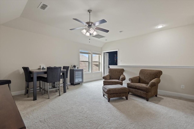 interior space with carpet floors, a ceiling fan, baseboards, and visible vents