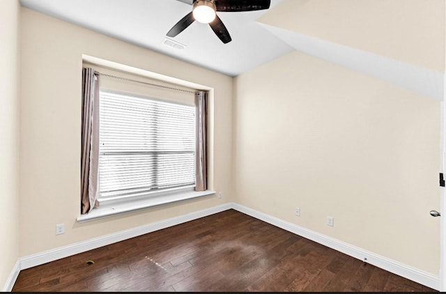 unfurnished room with a ceiling fan, baseboards, visible vents, and dark wood-type flooring