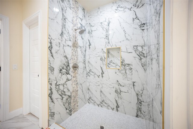 full bathroom featuring a marble finish shower and marble finish floor