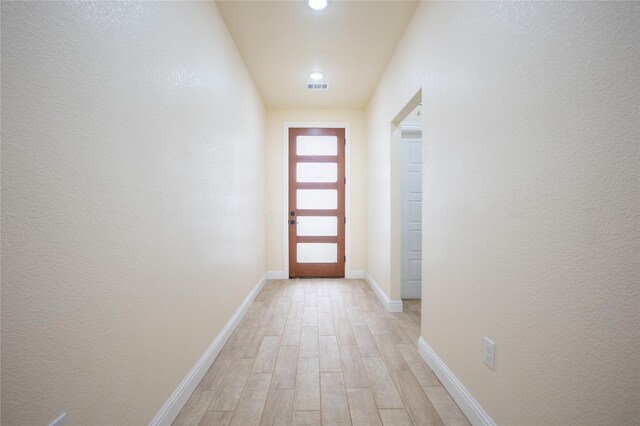 entryway featuring recessed lighting, baseboards, visible vents, and light wood-style flooring