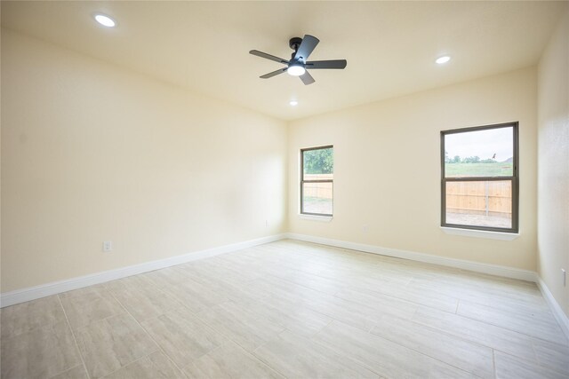 spare room featuring baseboards, ceiling fan, and recessed lighting