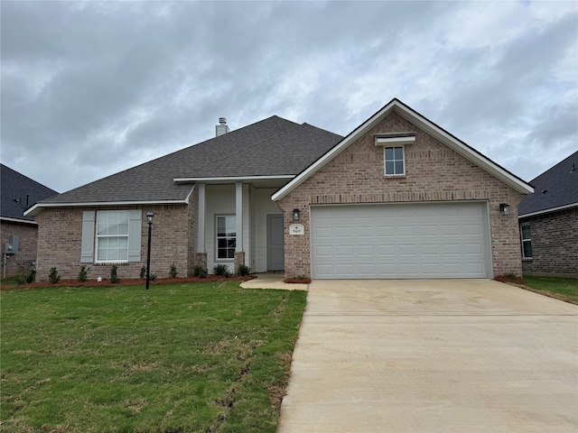 view of front of home with a shingled roof, a front lawn, brick siding, a garage, and concrete driveway