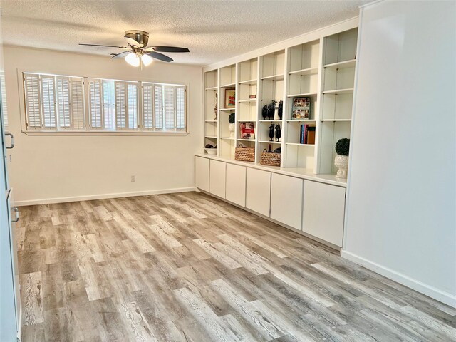 bathroom featuring toilet, baseboards, a sink, and tile patterned flooring