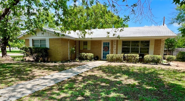 single story home featuring fence and brick siding