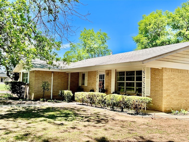 exterior space with brick siding