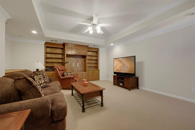 living room featuring a raised ceiling, ceiling fan, recessed lighting, and light colored carpet