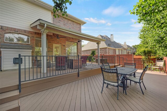 deck featuring outdoor dining area