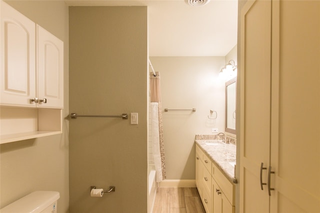 3211 Lockmoor Ln, Dallas, TX 75220 - bathroom with toilet, baseboards, shower / bathtub combination with curtain, and vanity