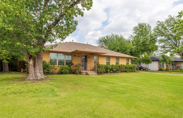 3211 Lockmoor Ln, Dallas, TX 75220 - view of front facade with a front yard and brick siding