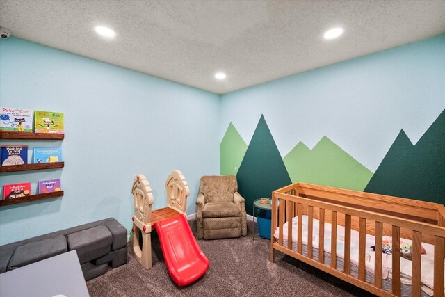 bedroom with recessed lighting, a textured ceiling, and carpet
