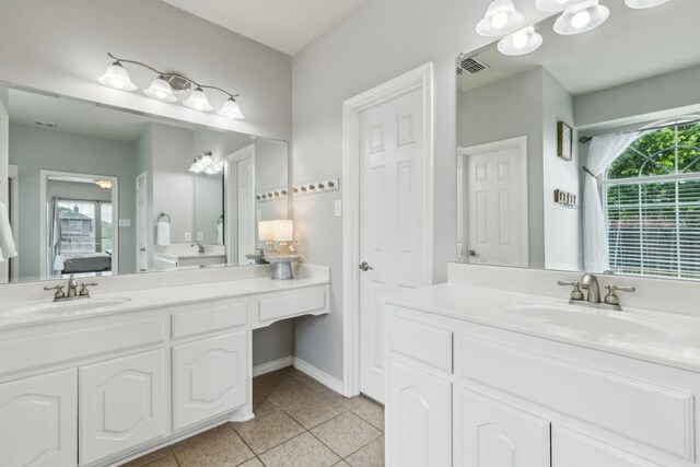 full bathroom featuring a sink, tile patterned flooring, ensuite bath, and visible vents