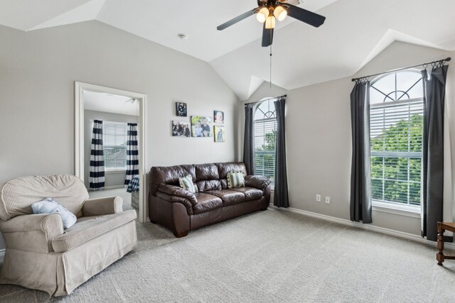carpeted living area featuring ceiling fan, vaulted ceiling, and baseboards
