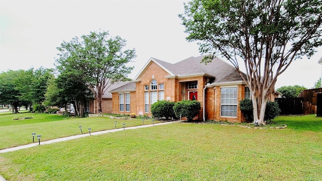 10408 Ambergate Ln, Frisco, TX 75035 - ranch-style house featuring brick siding, a front lawn, and fence