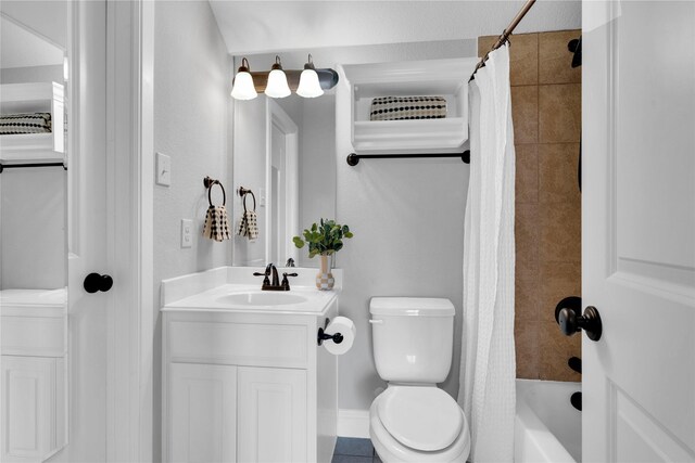 bathroom featuring vanity, shower / tub combo, baseboards, and toilet