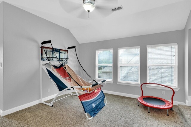 recreation room featuring carpet floors, baseboards, a ceiling fan, and visible vents